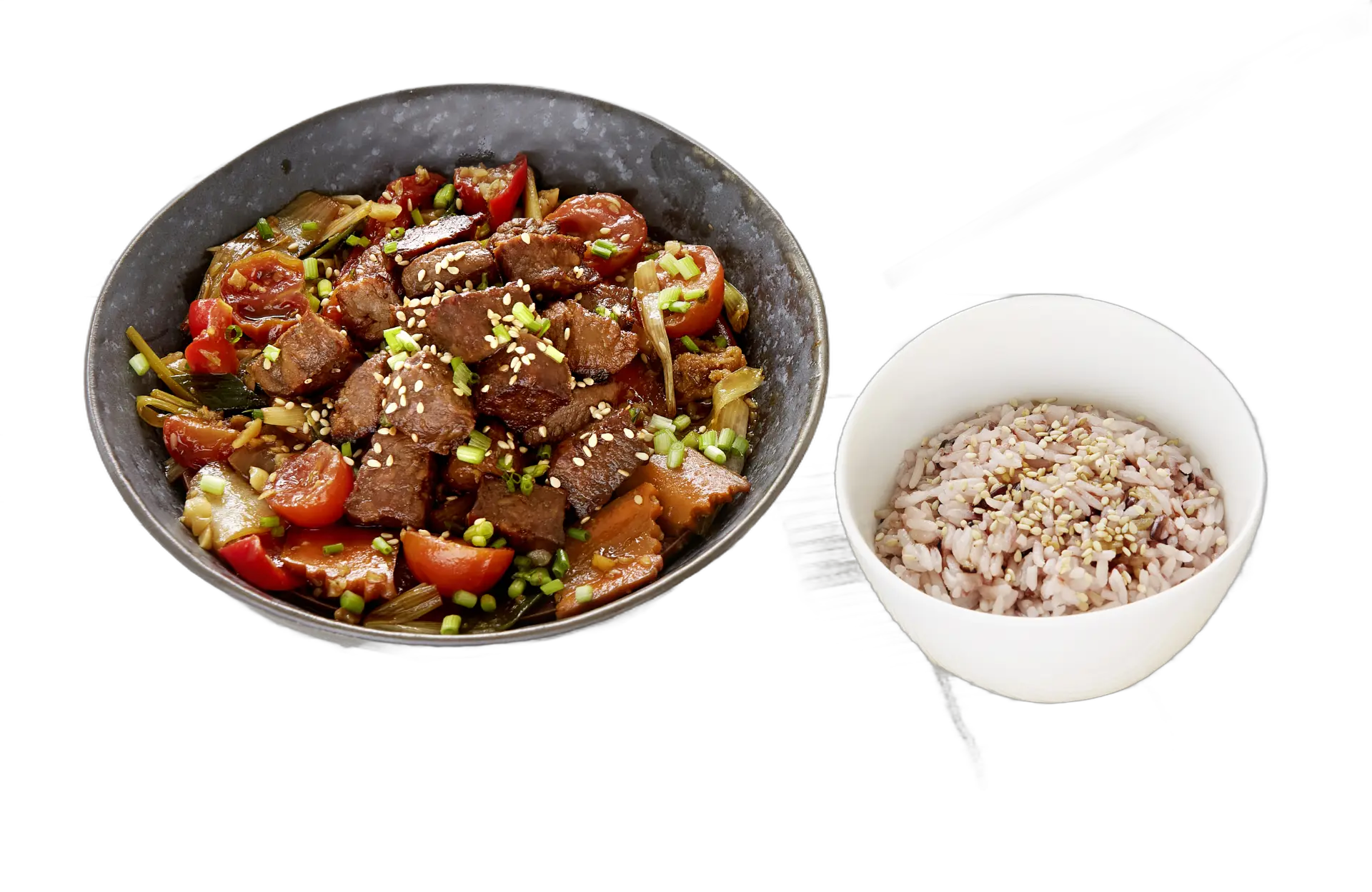Stir-fried beef-style pieces beside a bowl of rice